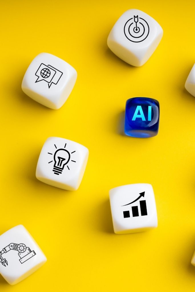 A set of symbol-covered dice on a yellow surface