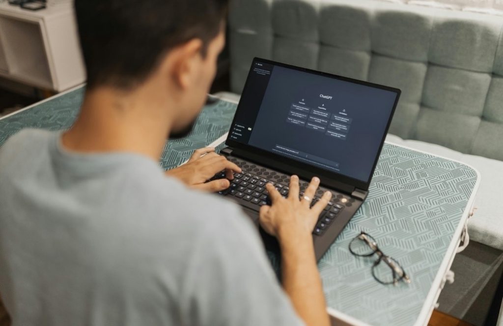 Developer writing software on a laptop