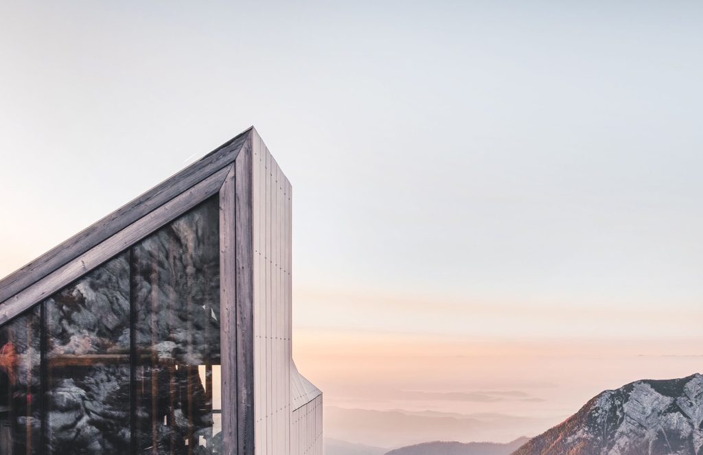 A timber-sided building photographed at sunset