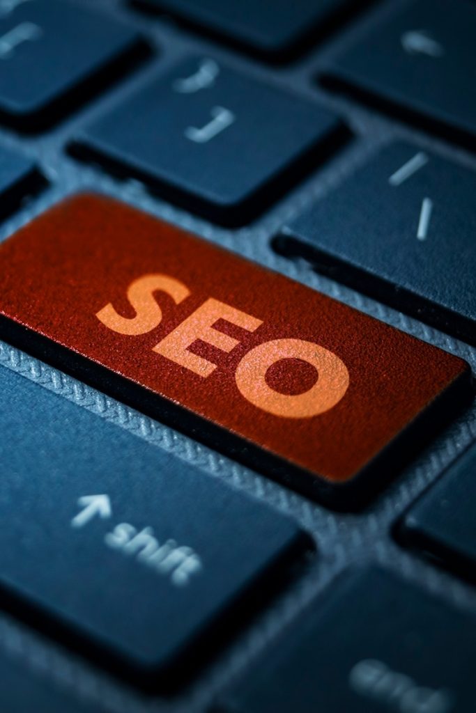 SEO printed on a bright orange keyboard key